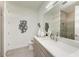 Modern bathroom featuring a single sink, quartz countertop, soft-close cabinets, and stylish fixtures at 6013 White Mangrove Ln, Bradenton, FL 34210