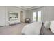 Bright bedroom with an accent wall and a double-glass patio door with plenty of natural light at 6013 White Mangrove Ln, Bradenton, FL 34210