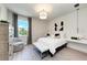 Bright bedroom with contemporary decor and a large window allowing natural light at 6013 White Mangrove Ln, Bradenton, FL 34210