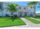 Charming townhome with well-manicured lawn, professional landscaping and a beautiful stone walkway at 6013 White Mangrove Ln, Bradenton, FL 34210