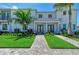 Charming townhome with well-manicured lawn, professional landscaping and a beautiful stone walkway at 6013 White Mangrove Ln, Bradenton, FL 34210