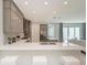 Bright kitchen with quartz countertops, bar seating, and seamless flow to the living area at 6013 White Mangrove Ln, Bradenton, FL 34210