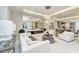 Elegant living room with modern chandelier, fireplace, sleek decor, and an open floor plan at 6013 White Mangrove Ln, Bradenton, FL 34210