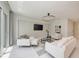 This living room features neutral tones, modern lighting, and an adjacent patio at 6013 White Mangrove Ln, Bradenton, FL 34210