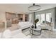 Bright living space open to kitchen features modern lighting, neutral tones, and adjacent patio at 6013 White Mangrove Ln, Bradenton, FL 34210