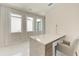 Home office featuring neutral tones, hard surface flooring, and a built-in desk at 6013 White Mangrove Ln, Bradenton, FL 34210