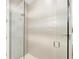 Modern glass enclosed shower with stylish textured tile and sleek fixtures at 6013 White Mangrove Ln, Bradenton, FL 34210