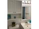 Bathroom with vanity, updated lighting, and a mirrored cabinet at 6032 Arlene Way, Bradenton, FL 34207
