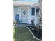 Close up of decorated front entrance to condo with plants and seating at 6032 Arlene Way, Bradenton, FL 34207
