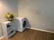 Convenient laundry area equipped with a washer, and shelving unit for storage solutions at 6032 Arlene Way, Bradenton, FL 34207