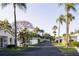 Neighborhood street lined with well-maintained homes and lush tropical landscaping, creating a welcoming atmosphere at 6032 Arlene Way, Bradenton, FL 34207