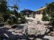 Backyard space with an in-ground pool, surrounded by lush tropical plants at 604 Dundee Ln, Holmes Beach, FL 34217