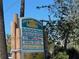 Beach cafe sign with list of food, surf, and music options at 604 Dundee Ln, Holmes Beach, FL 34217