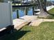 Waterfront dock with adjacent grass and clear views of boats and water at 604 Dundee Ln, Holmes Beach, FL 34217