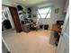 Office space with computer, shelving, bright window and additional table space at 604 Dundee Ln, Holmes Beach, FL 34217
