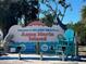 Welcome to Holmes Beach on Anna Maria Island sign with local businesses at 604 Dundee Ln, Holmes Beach, FL 34217