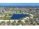 Wide aerial shot of the community, featuring the pond, landscaping, and overall neighborhood layout at 6418 13Th Avenue W Dr # 6418, Bradenton, FL 34209