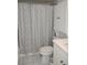 Bathroom featuring a shower with a stylish curtain, a vanity, and a toilet at 6924 Stones Throw N Cir # 8105, St Petersburg, FL 33710