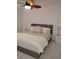 Comfortable bedroom with a bed and two nightstands at 6924 Stones Throw N Cir # 8105, St Petersburg, FL 33710
