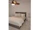 Comfortable bedroom with a bed and two nightstands at 6924 Stones Throw N Cir # 8105, St Petersburg, FL 33710