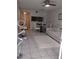 Bright open-concept living and dining area with modern furniture and decor at 6924 Stones Throw N Cir # 8105, St Petersburg, FL 33710