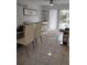 Bright living room with tile floors, stylish furniture, and sliding glass doors to the outside at 6924 Stones Throw N Cir # 8105, St Petersburg, FL 33710