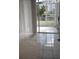 Enclosed patio with tile floors, offering serene water views and access to the outdoors at 6924 Stones Throw N Cir # 8105, St Petersburg, FL 33710