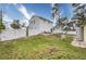 Large fenced backyard with a lush green lawn, perfect for outdoor activities at 7067 Jarvis Rd, Sarasota, FL 34241
