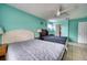Spacious bedroom features two beds, tile floors, and a ceiling fan at 7067 Jarvis Rd, Sarasota, FL 34241