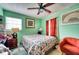 Inviting bedroom with a bed, chair, dresser, and a ceiling fan at 7067 Jarvis Rd, Sarasota, FL 34241