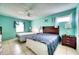 Bright bedroom features two beds, tile floors, and a ceiling fan at 7067 Jarvis Rd, Sarasota, FL 34241