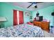 Comfortable bedroom featuring a ceiling fan and natural lighting at 7067 Jarvis Rd, Sarasota, FL 34241