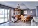 Elegant dining room featuring a large china cabinet and sliding glass doors to the yard at 7067 Jarvis Rd, Sarasota, FL 34241