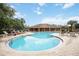 Bright community pool area with ample seating and a clear blue pool at 7326 Skybird Rd, Bradenton, FL 34209