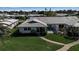 Inviting backyard featuring a screened lanai, outdoor seating, and a well-manicured lawn for relaxing outdoor living at 7402 9Th Ave W # 7402, Bradenton, FL 34209