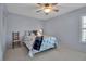 Cozy bedroom with ceiling fan and ample lighting at 7402 9Th Ave W # 7402, Bradenton, FL 34209