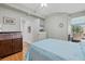 Comfortable bedroom features hardwood floors, plenty of space, and a built-in desk at 7416 Botanica Pkwy # 103, Sarasota, FL 34238
