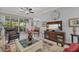 Inviting living room with neutral color palette and open access to the screened lanai at 7416 Botanica Pkwy # 103, Sarasota, FL 34238