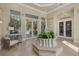 Inviting lobby area with comfortable seating and direct access to community amenities at 7416 Botanica Pkwy # 103, Sarasota, FL 34238