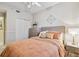 Well-lit bedroom featuring a comfortable bed, closet, dresser, ceiling fan, and neutral decor at 803 Fairwaycove Ln # 106, Bradenton, FL 34212