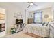 Comfortable bedroom featuring a ceiling fan, TV, dresser, and a cozy bed with patterned bedding at 803 Fairwaycove Ln # 106, Bradenton, FL 34212