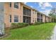 Spacious condo building with screened patios and a large lawn area for outdoor enjoyment at 803 Fairwaycove Ln # 106, Bradenton, FL 34212