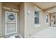 Charming condo front door with decorative wreath. The walkway is well lit and well maintained at 803 Fairwaycove Ln # 106, Bradenton, FL 34212