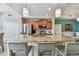 Spacious kitchen island with granite countertop, bar seating, stainless appliances, and storage at 803 Fairwaycove Ln # 106, Bradenton, FL 34212