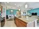 Spacious kitchen with granite countertops, stainless steel appliances, and an open concept design at 803 Fairwaycove Ln # 106, Bradenton, FL 34212