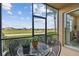 Inviting lanai provides stunning community views, a bistro set, and comfortable outdoor living space at 803 Fairwaycove Ln # 106, Bradenton, FL 34212