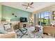 Cozy living room with slider access to lanai and view of the backyard at 803 Fairwaycove Ln # 106, Bradenton, FL 34212