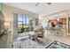 Open living space that leads to kitchen and has access to lanai at 803 Fairwaycove Ln # 106, Bradenton, FL 34212