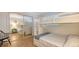 Bedroom featuring bunkbeds, a chair, and tile flooring at 101 Base E Ave # 101 103, Venice, FL 34285