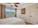 Bright bedroom featuring a window and neutral decor with tile flooring at 101 Base E Ave # 101 103, Venice, FL 34285